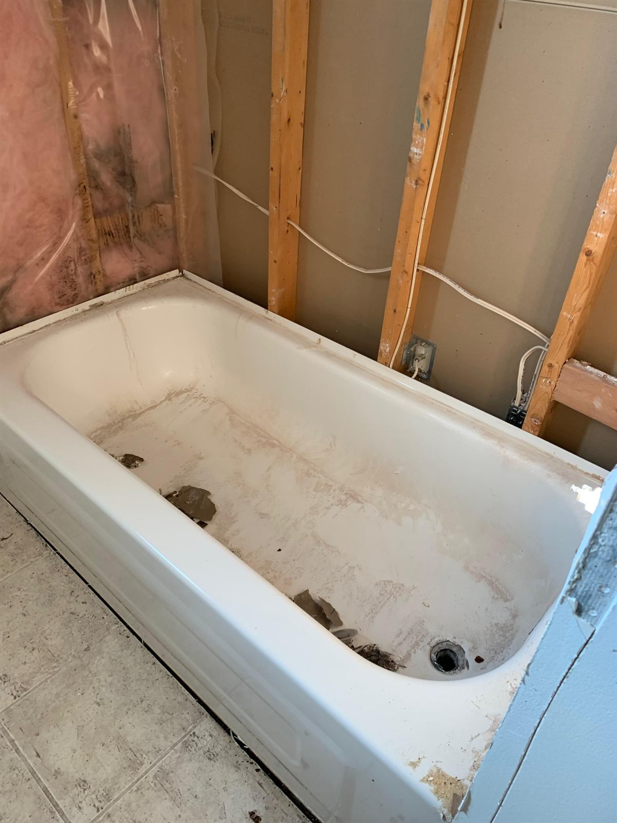 Professional site prep, dust containment, and rough-in framing for a bathroom remodel