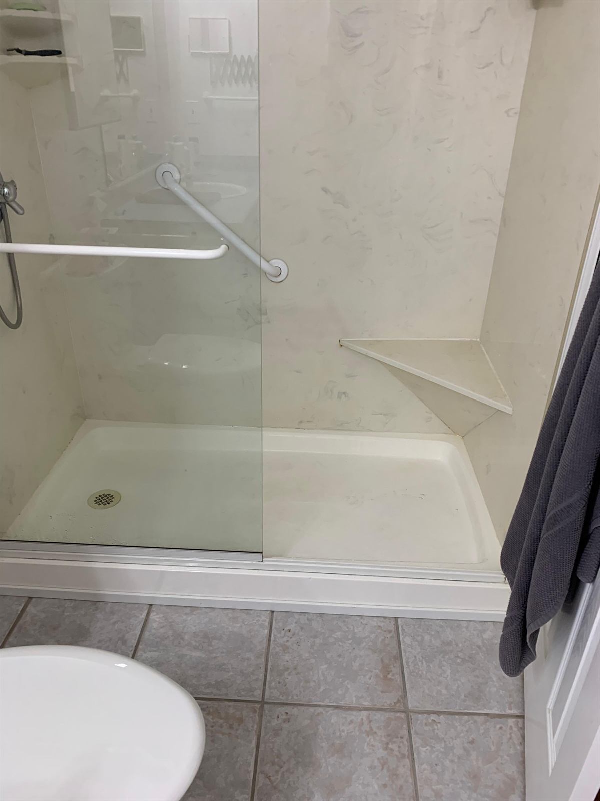 Completed modern shower stall installation with clean finishes and updated fixtures