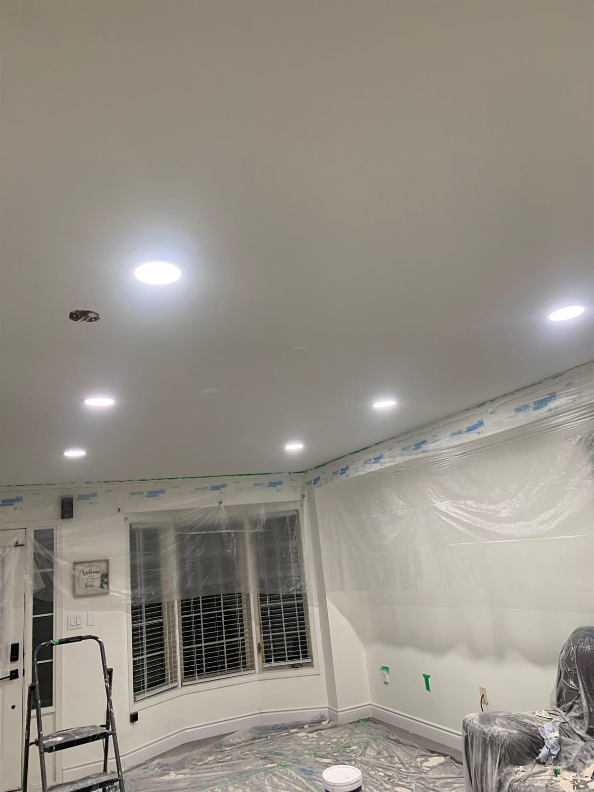 Drywall repair and modern recessed lighting installation for a brighter living space