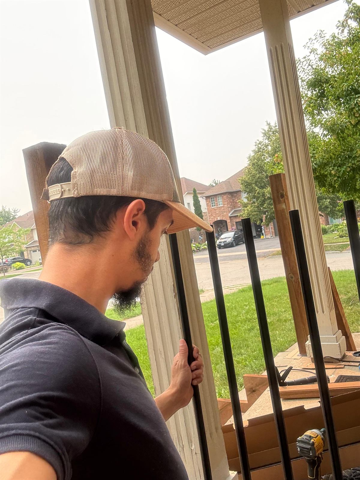 Leveling support posts and adding the finishing trim to a front entryway porch