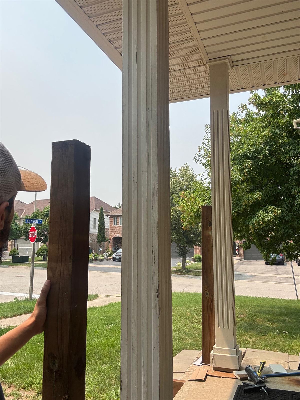 Leveling support posts and adding the finishing trim to a front entryway porch